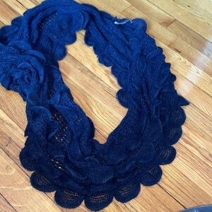 Gently used scalloped navy knit infinity scarf.